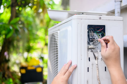 repairing outdoor AC condenser unit